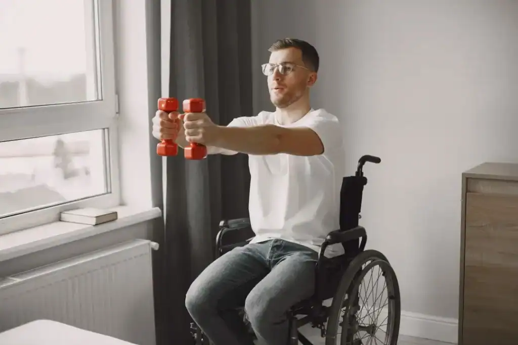 Image of man doing exercise in his wheelchair to aid weight loss Borehamwood