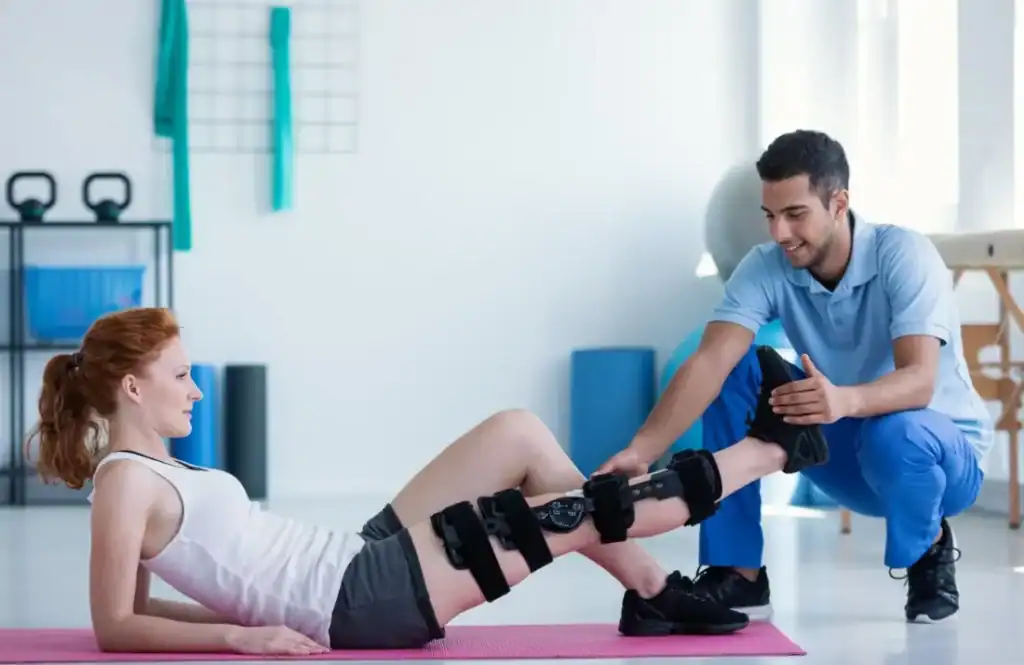 Woman having treatment to help muscle recovery Borehamwood after an injury