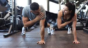 Sculpting Sleek Arms: The Essential Role of Cardio in Toning Without Bulking Up 1 Image of man and woman doing Cardio Borehamwood to tone their arms.